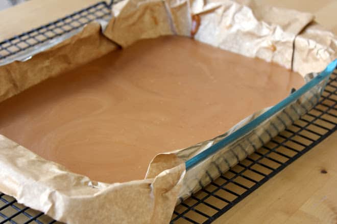 caramel cooling in glass pan on wire rack