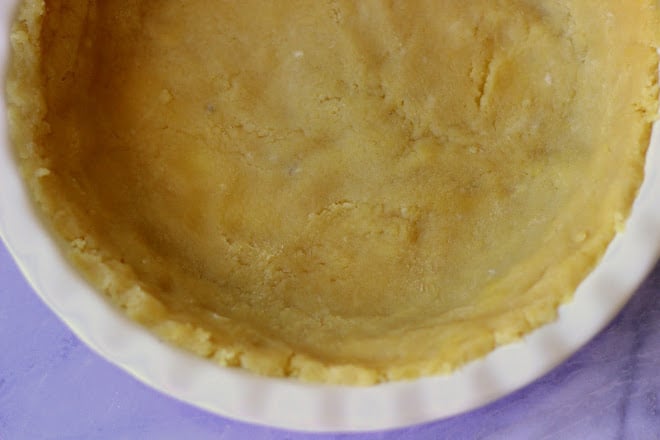 crust in white pie pan before baking 