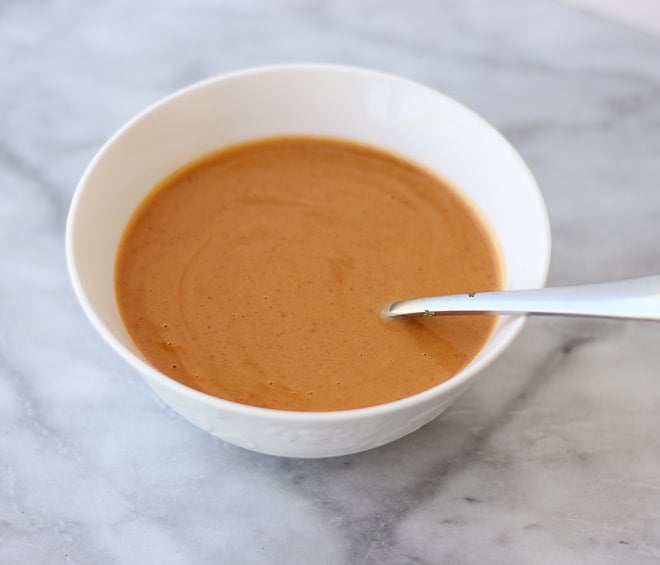 Aerial view of tomato soup in a white bowl