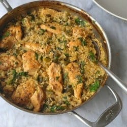 Skillet chicken with mexican green rice in a pan