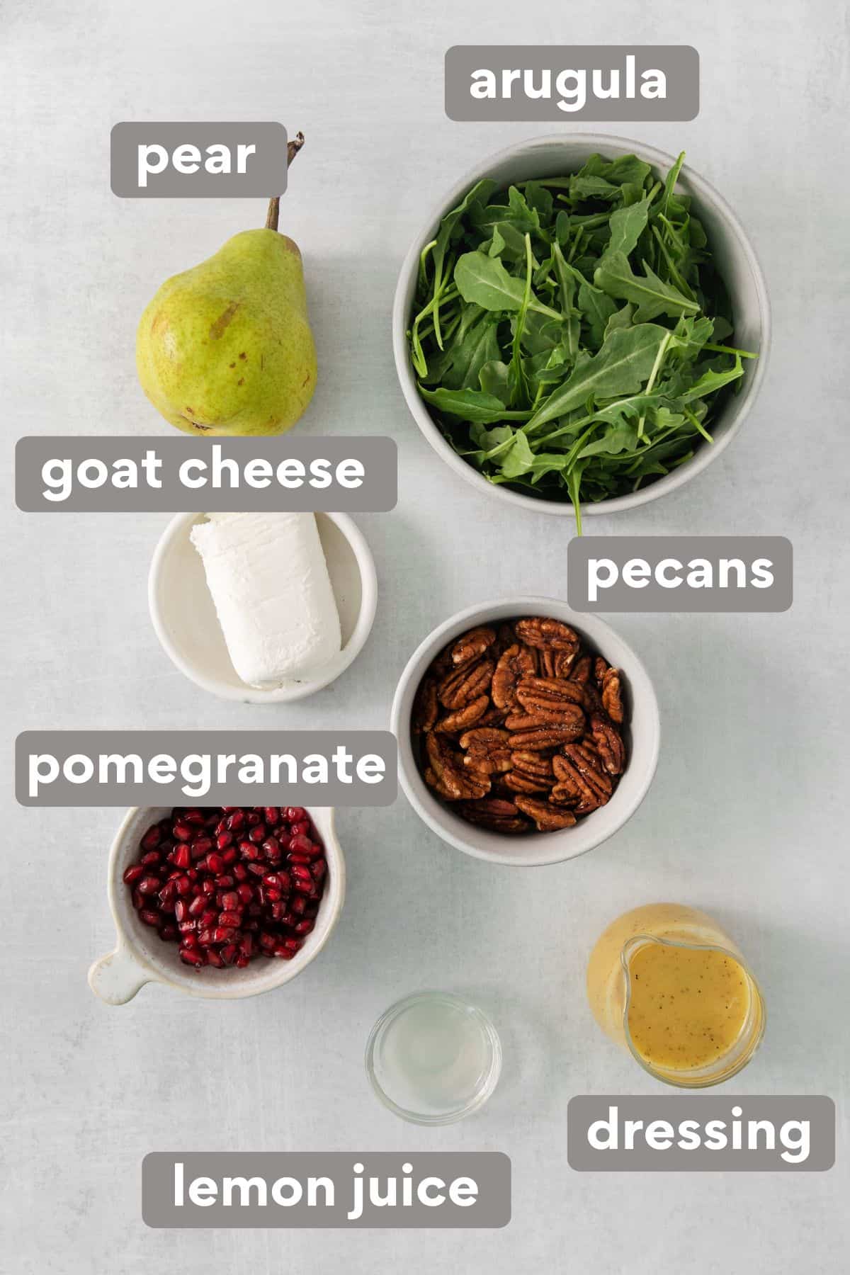 arugula pear salad ingredients on a countertop