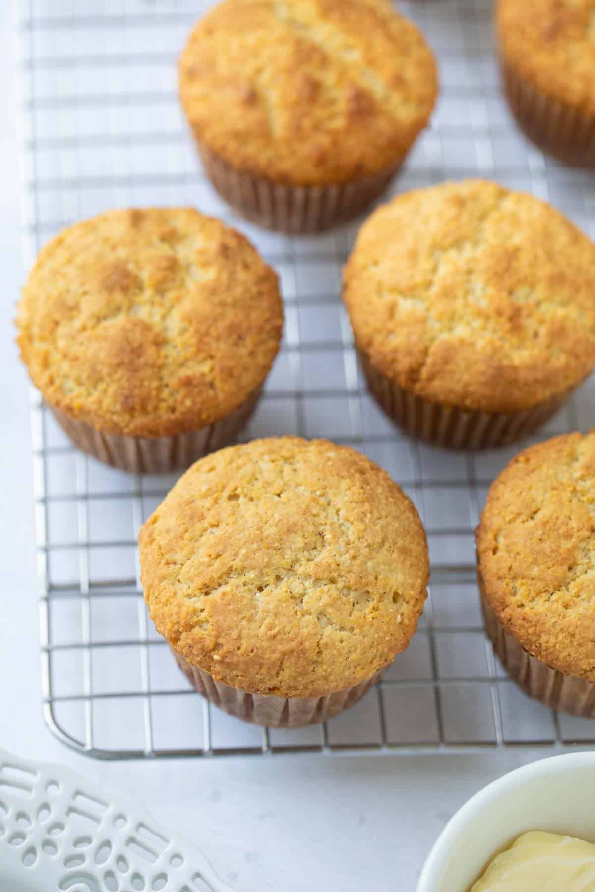 corn muffins cooling on a wire rack
