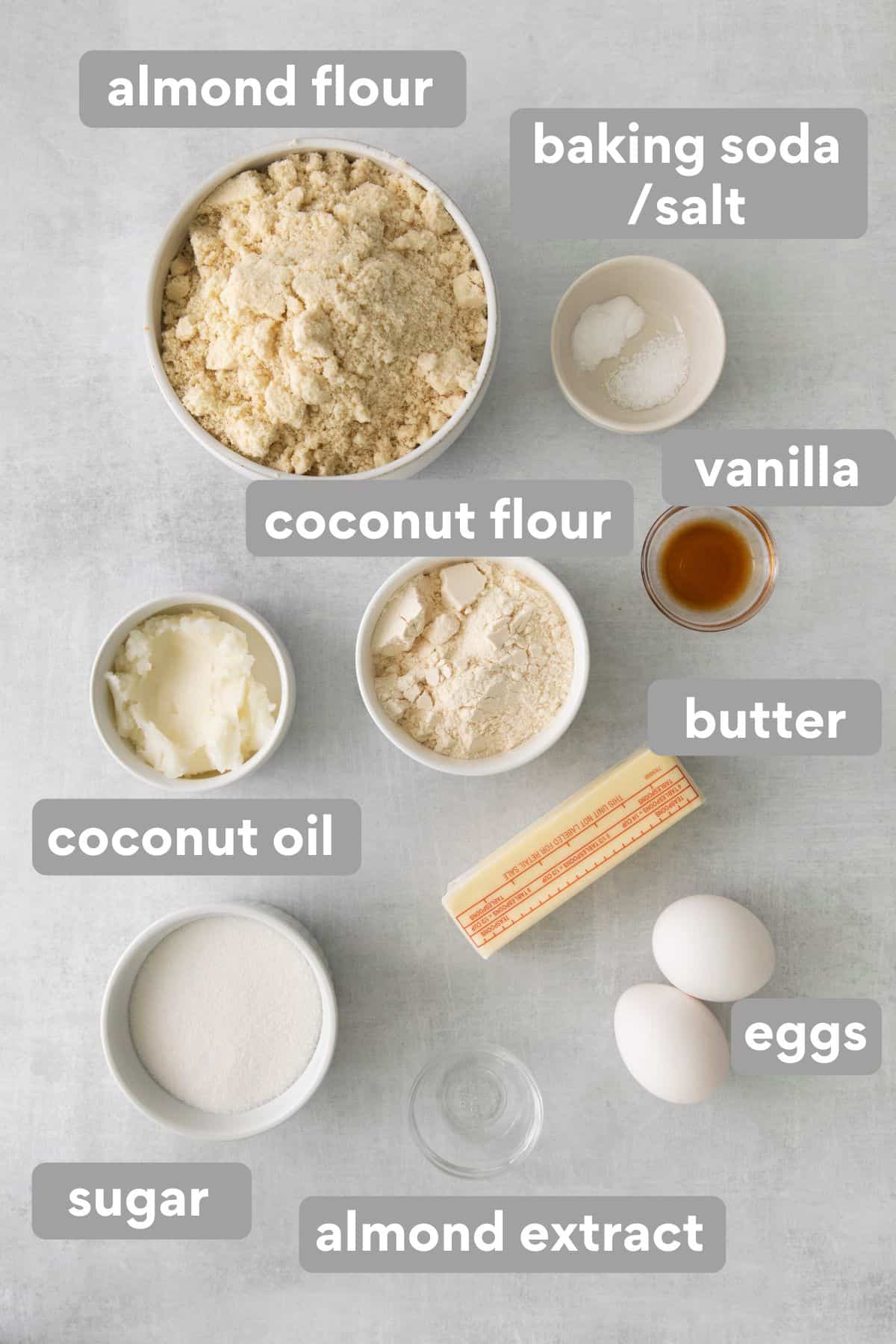 ingredients needed to make almond flour sugar cookies on white background