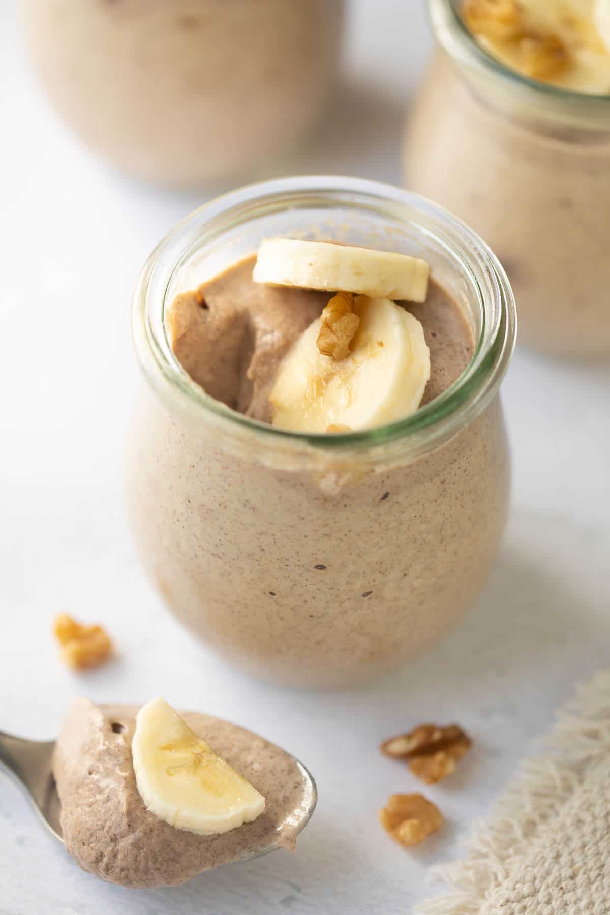 banana chia pudding in a small glass jar