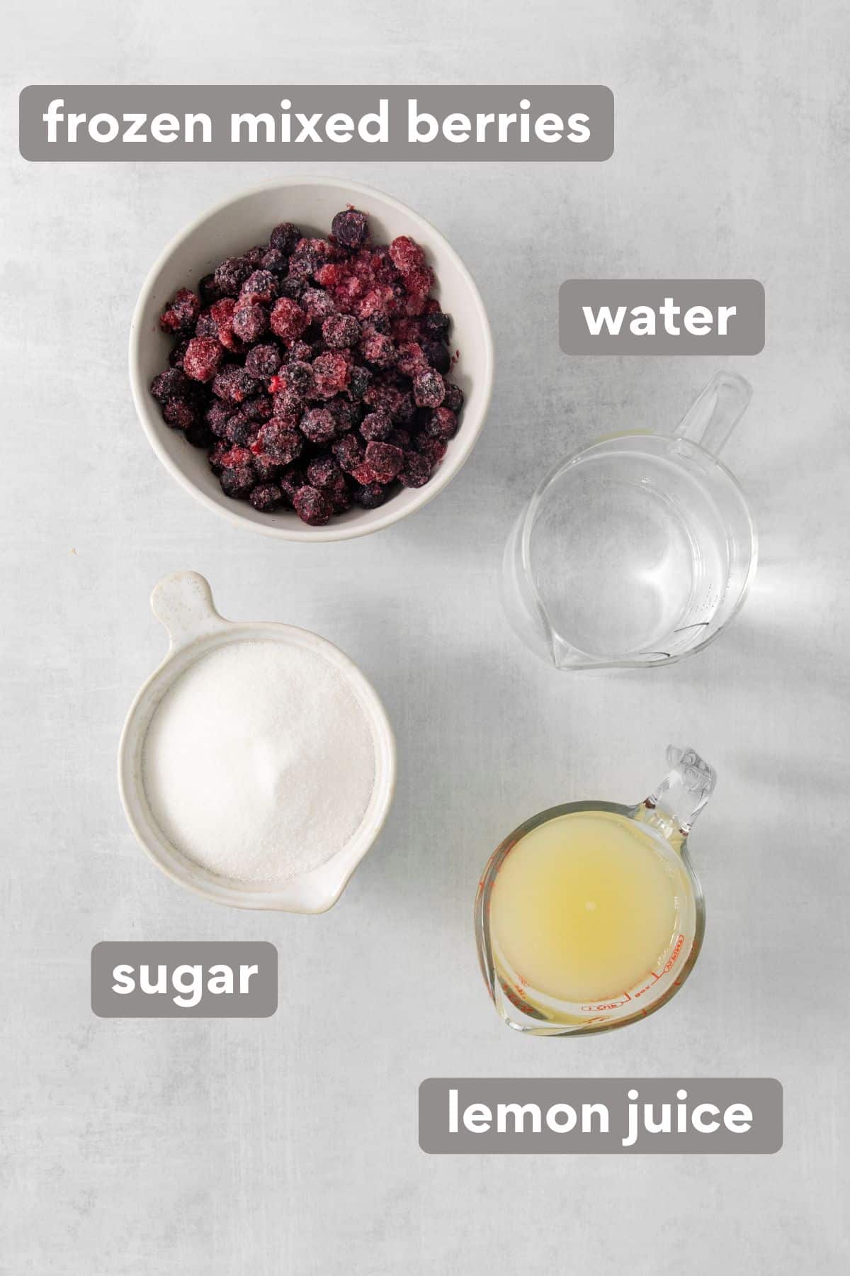 Ingredients for berry lemonade on a countertop