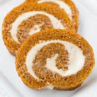 gluten-free pumpkin roll sliced and served on white plate