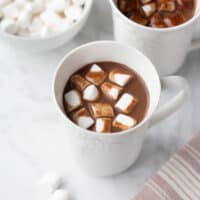 white mug of hot chocolate with marshmallows