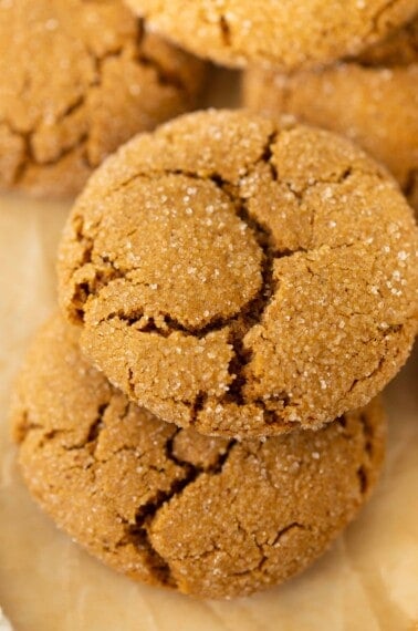 gluten-free molasses cookies up close on brown parchment paper