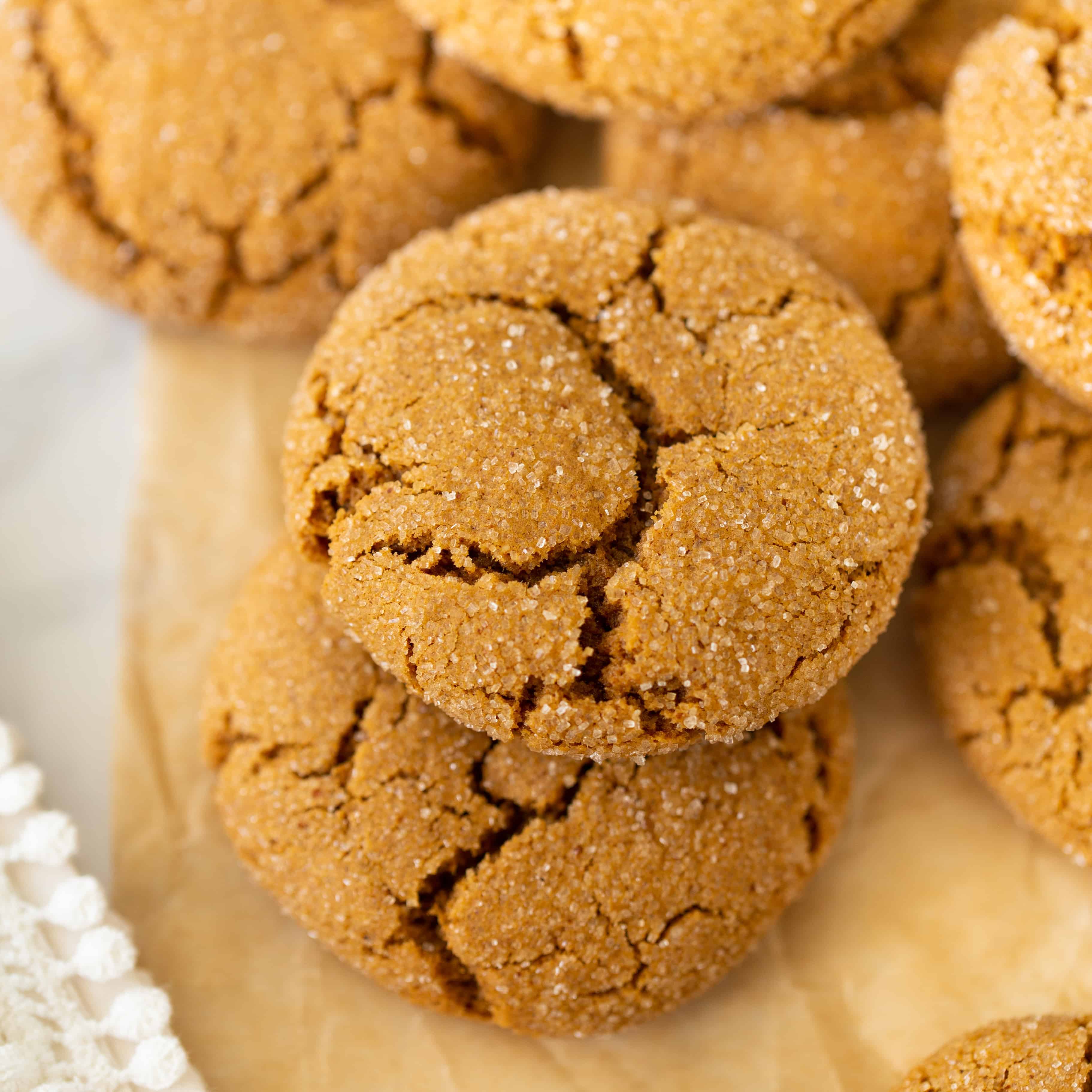 gluten-free molasses cookies up close on brown parchment paper