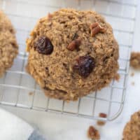 close up of oatmeal cookie with bananas, raisins, and nuts