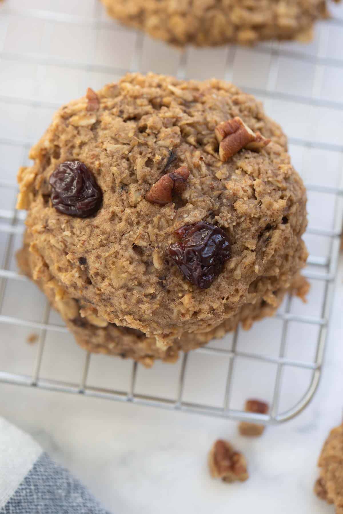 close up image of oatmeal cookie with bananas, raisins, and nuts