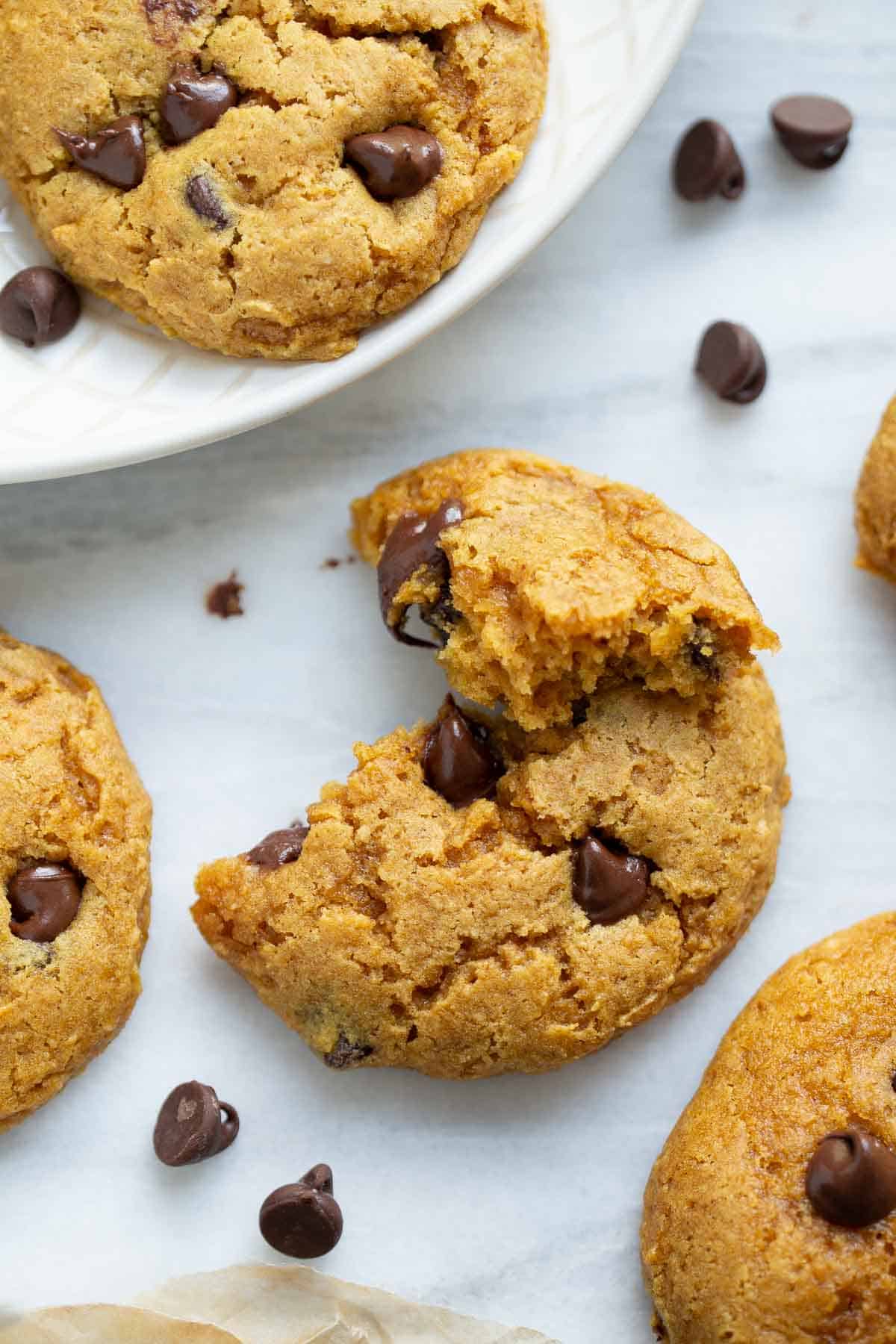 gluten-free pumpkin cookie on marble background with chocolate chips