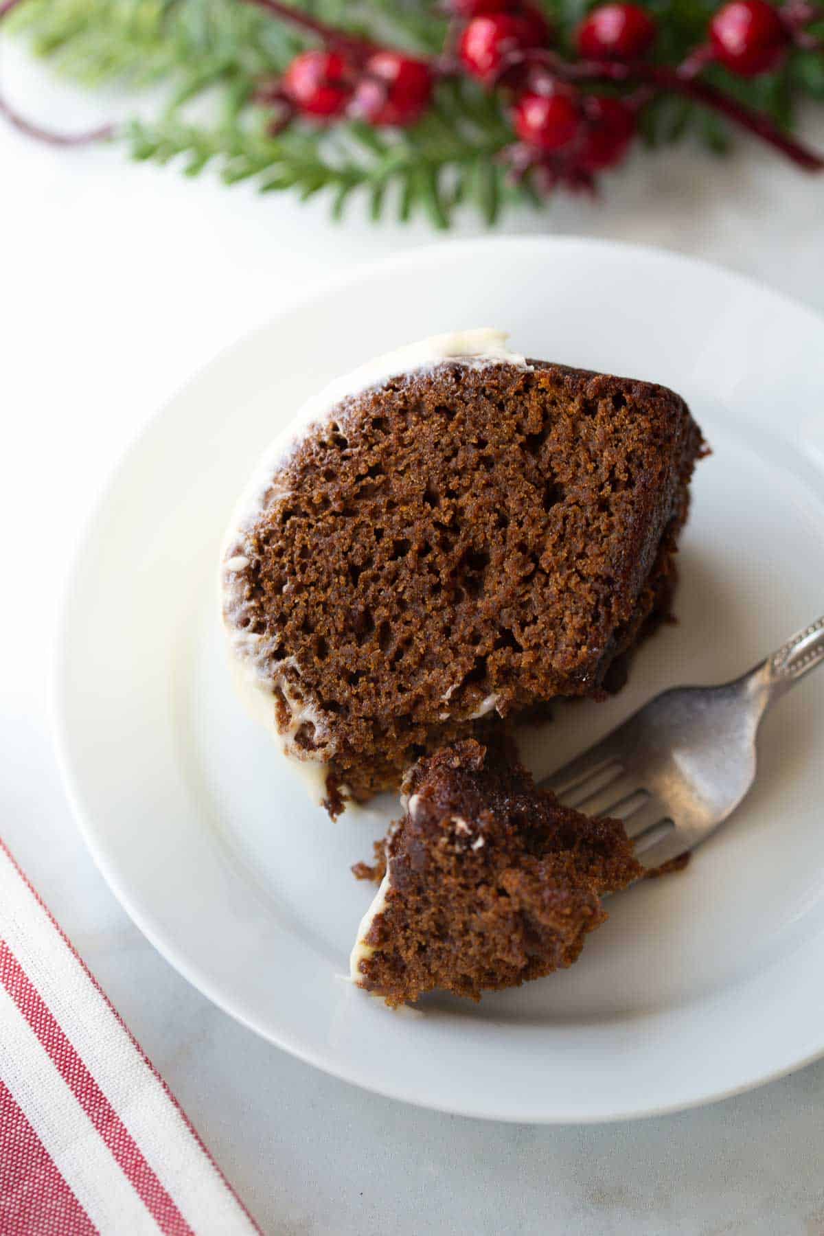 slice of gluten-free gingerbread on white plate 