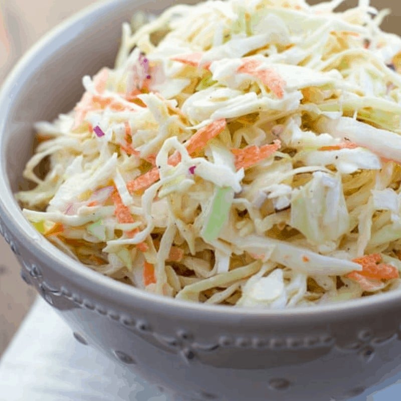 close up shot of coleslaw in gray bowl