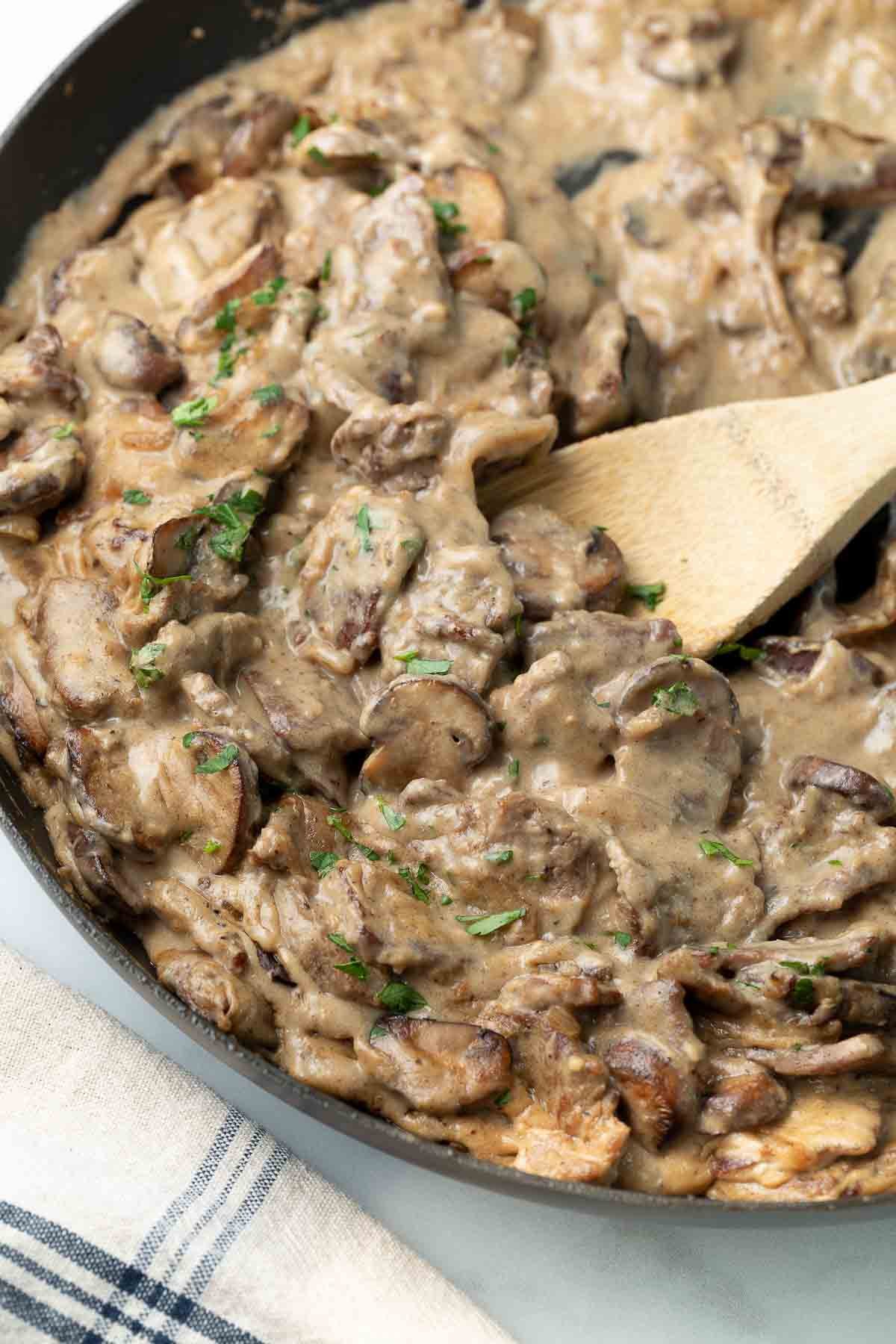 close up image of beef stroganoff in pan 
