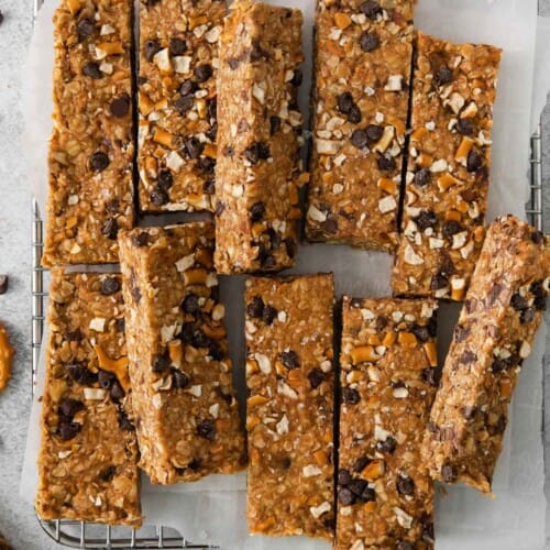 No-bake peanut butter oatmeal bars on a wire cooling rack with parchment paper
