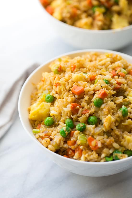 50/50 Cauli-Brown Rice Fried Rice! An easy fried rice made of ½ cooked brown rice and ½ cauliflower rice. One of my go-to healthy dinners! Easy, kid-friendly, yummy.
