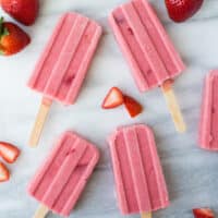 fruit popsicles on marble background