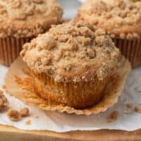 gluten free apple muffins with wrapped peeled sitting on white parchment