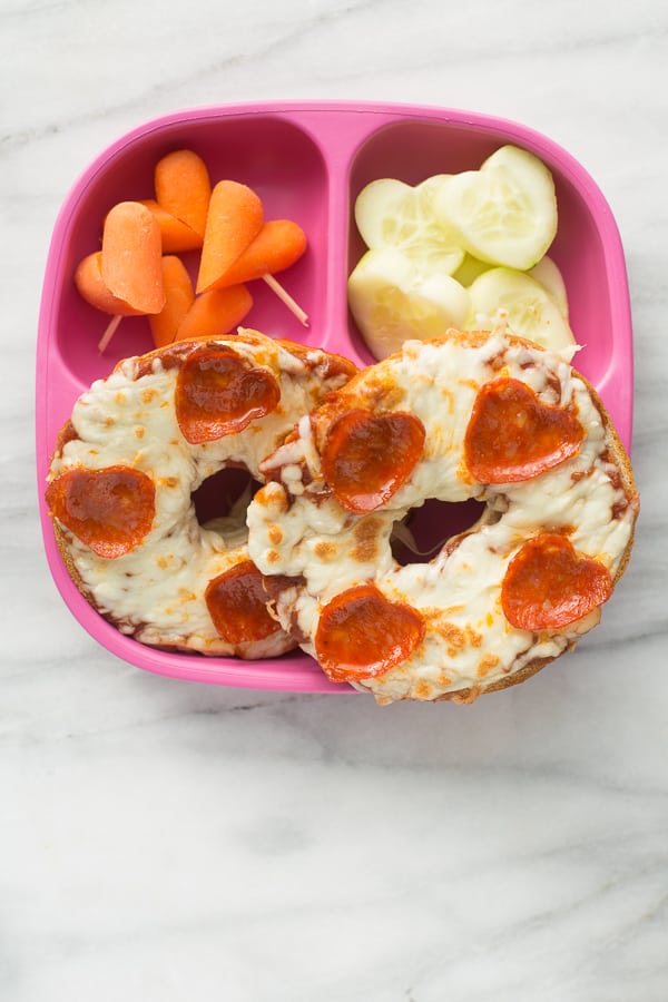 pizza bagel with heart pepperoni on pink plate
