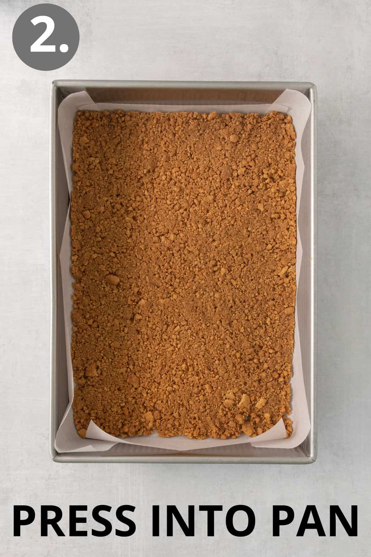 Graham cracker crumbs and butter pressed into a pan