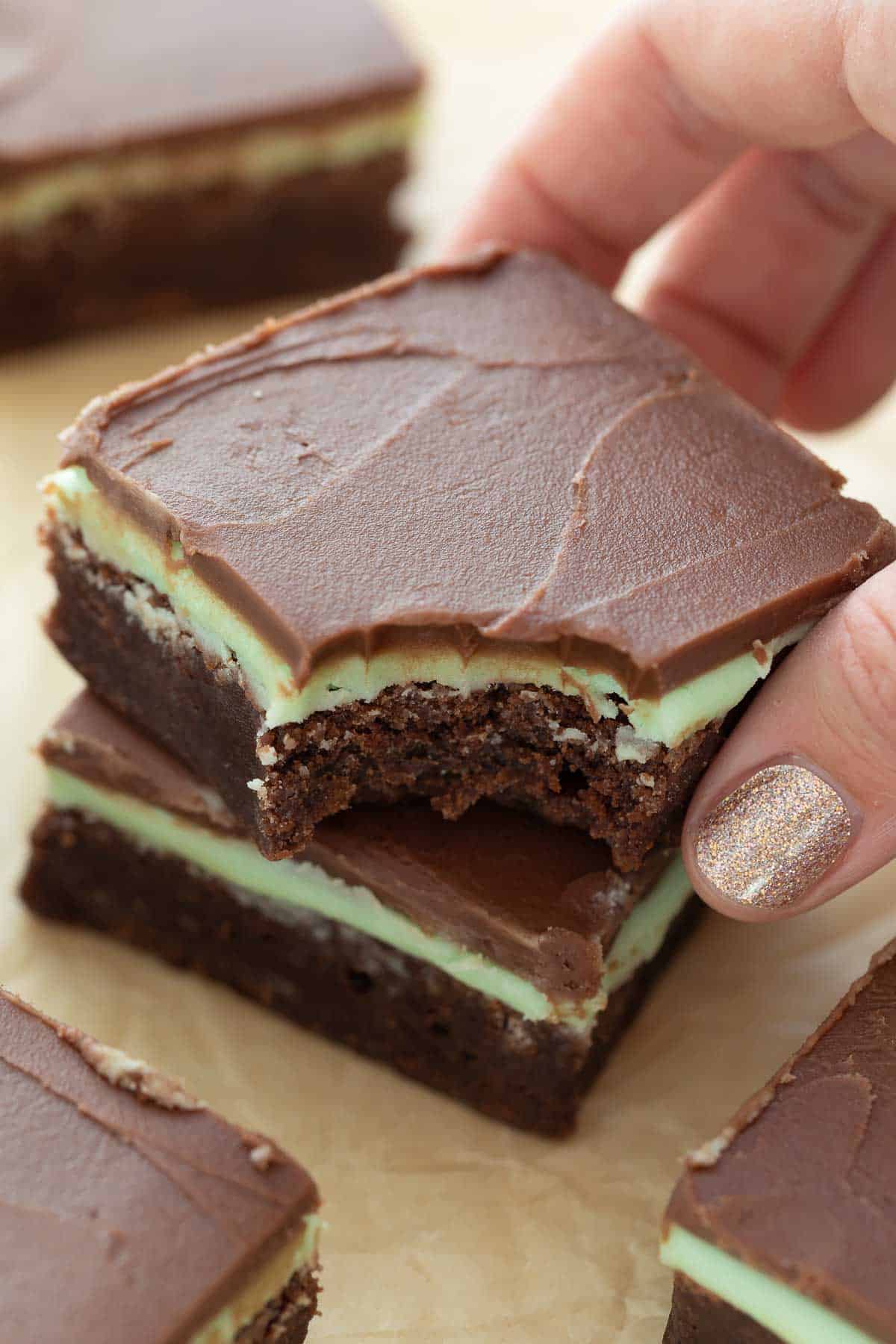gluten free mint brownies with bite taken out being held