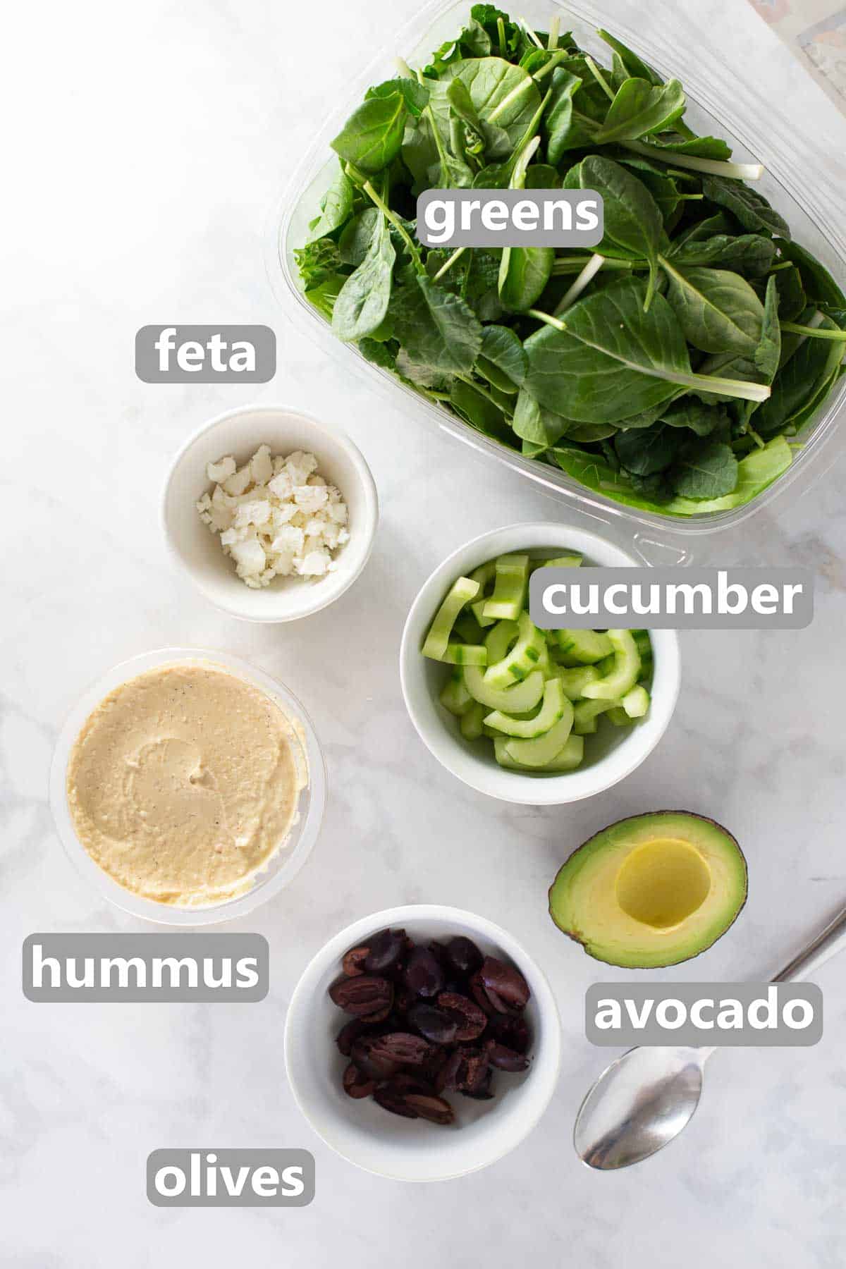 titled image showing ingredients to make a hummus veggie wrap