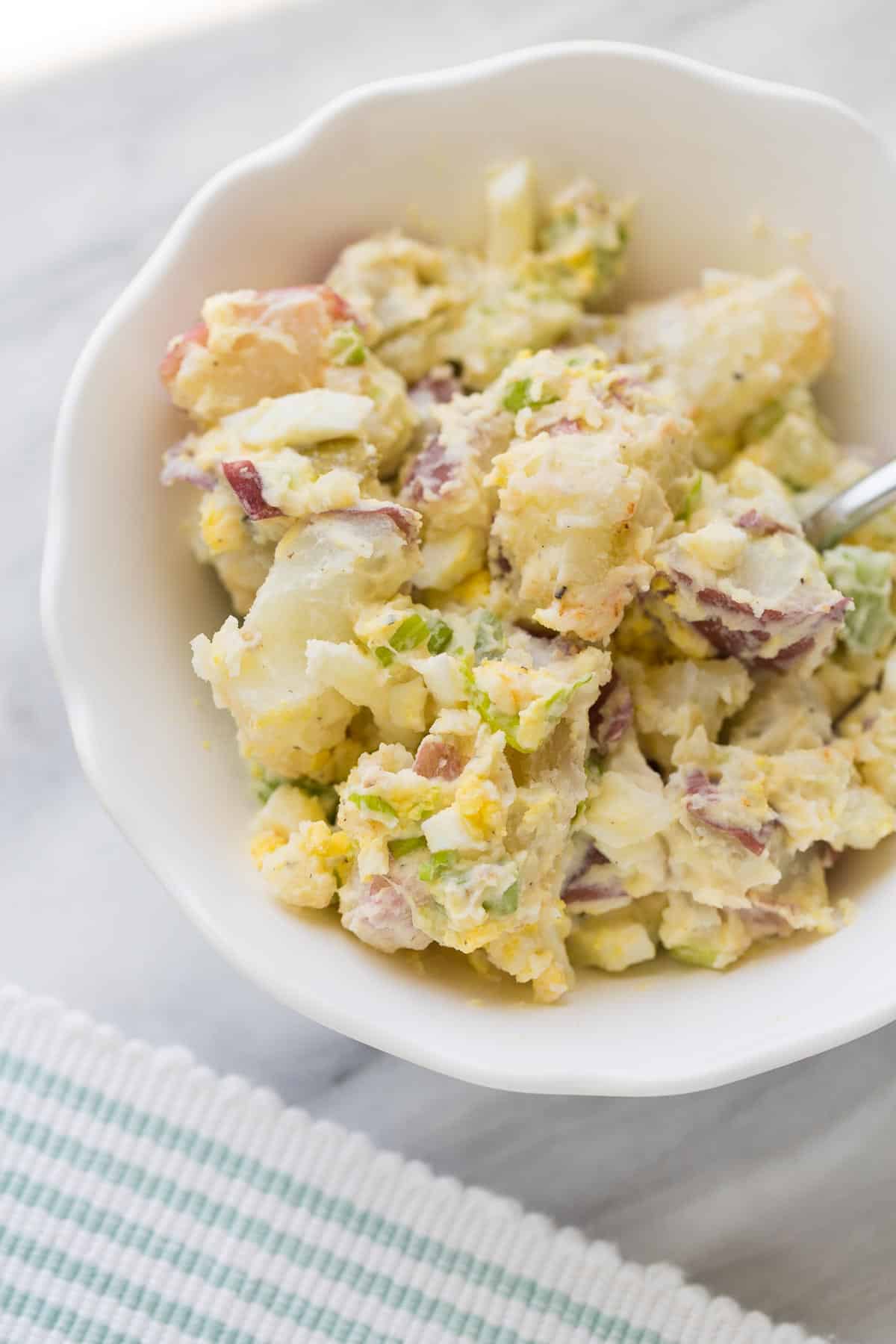 potato salad in bowl with fork