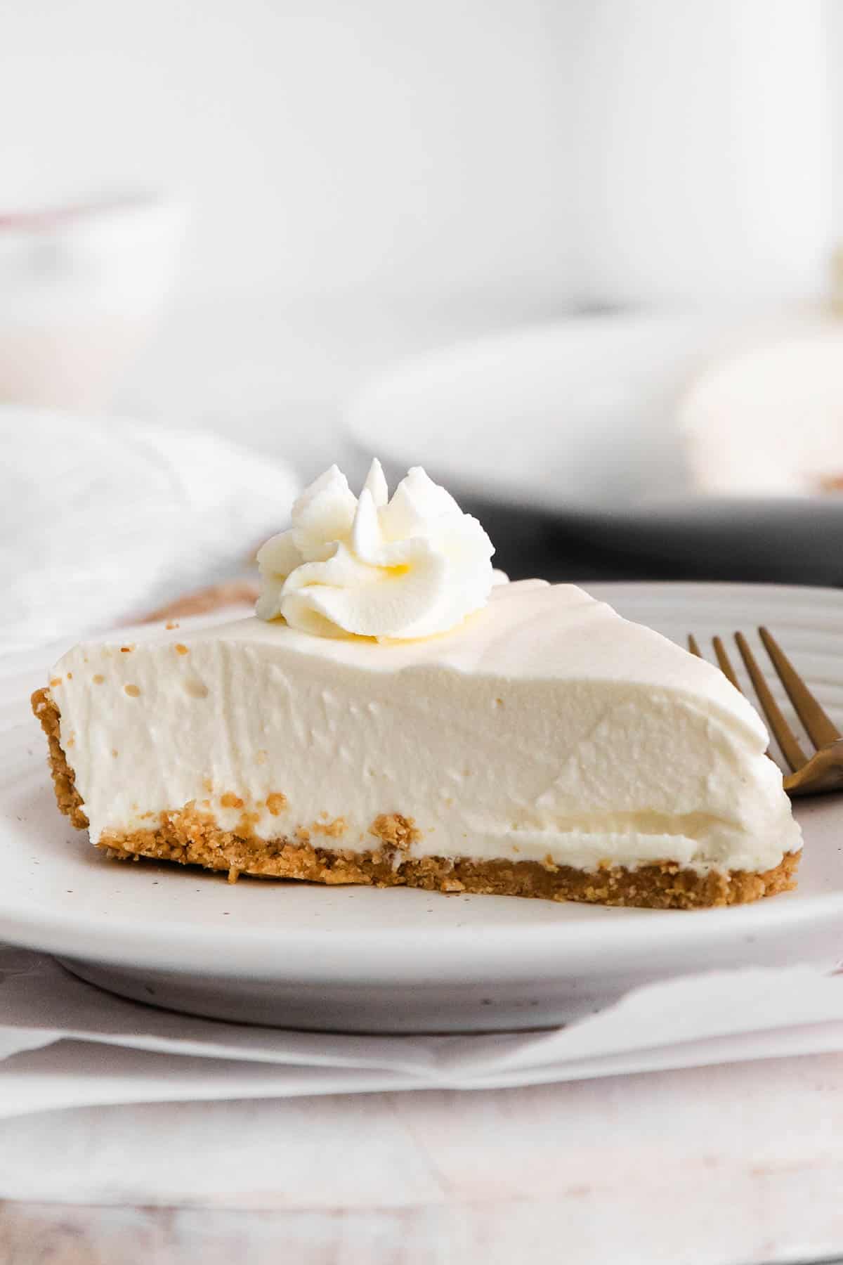 A slice of gluten-free no-bake cheesecake on a plate