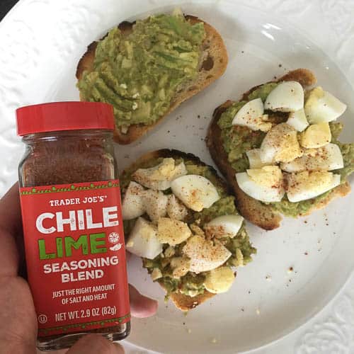 avocado toast topped with hard boiled egg and chili lime seasoning