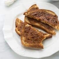 cinnamon toast on white plate with marble background