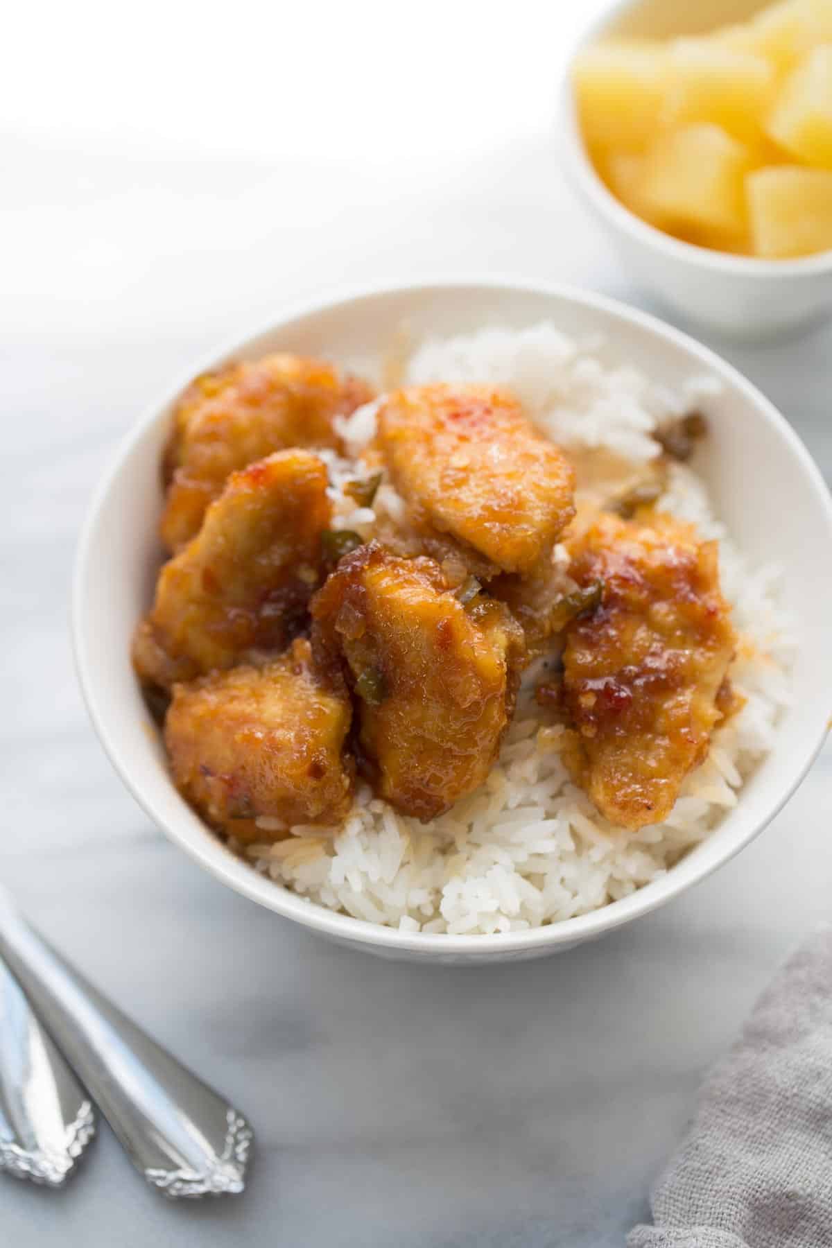 bowl of sticky chicken over white rice