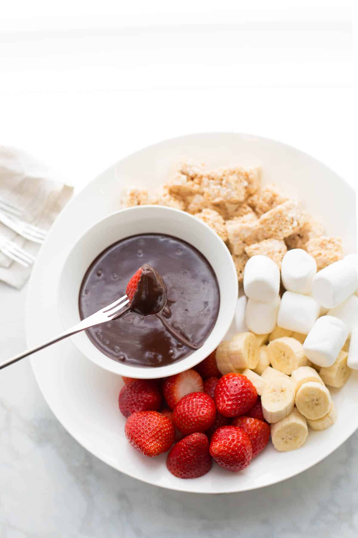 overhead shot of chocolate fondue being dipped