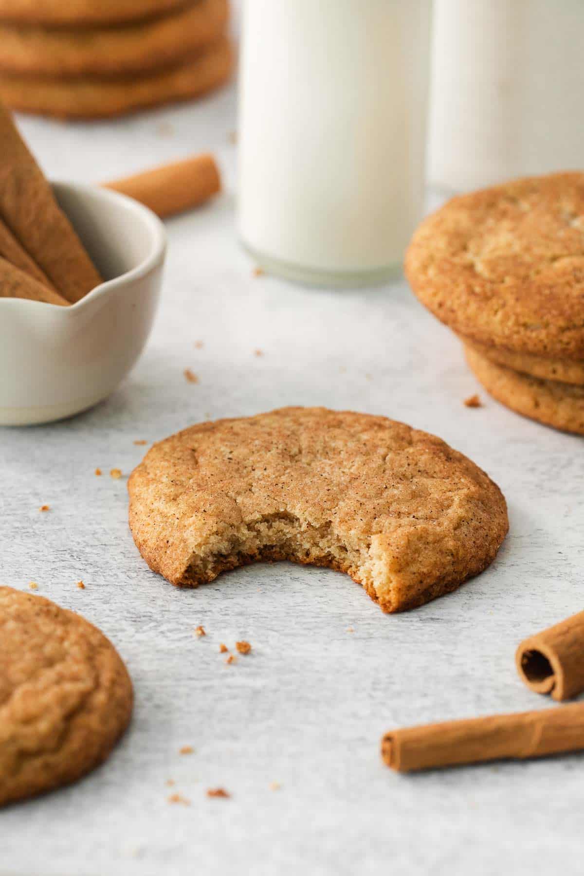 an almond flour snickerdoodle with a bite taken out of it