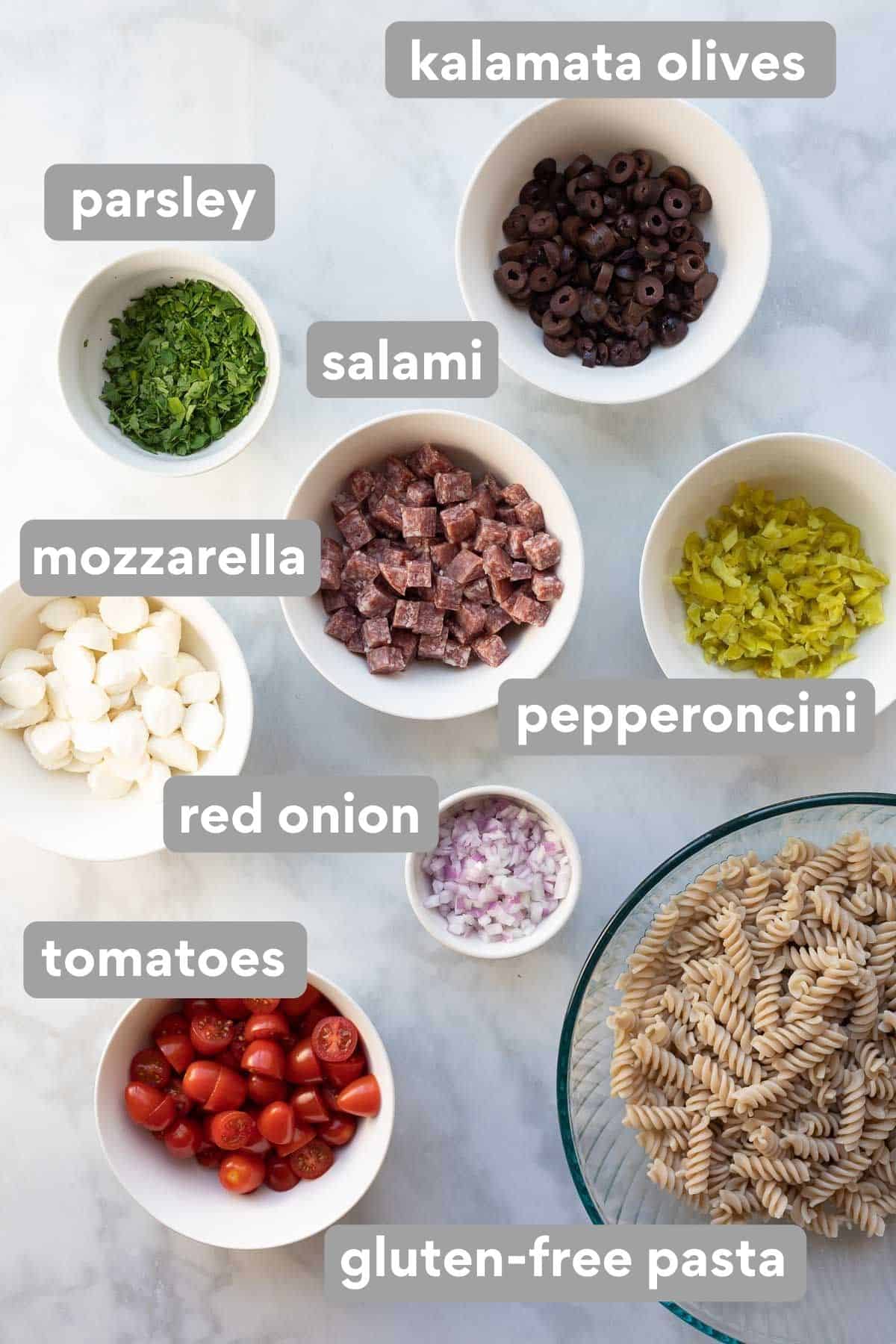 Pasta salad ingredients on a countertop