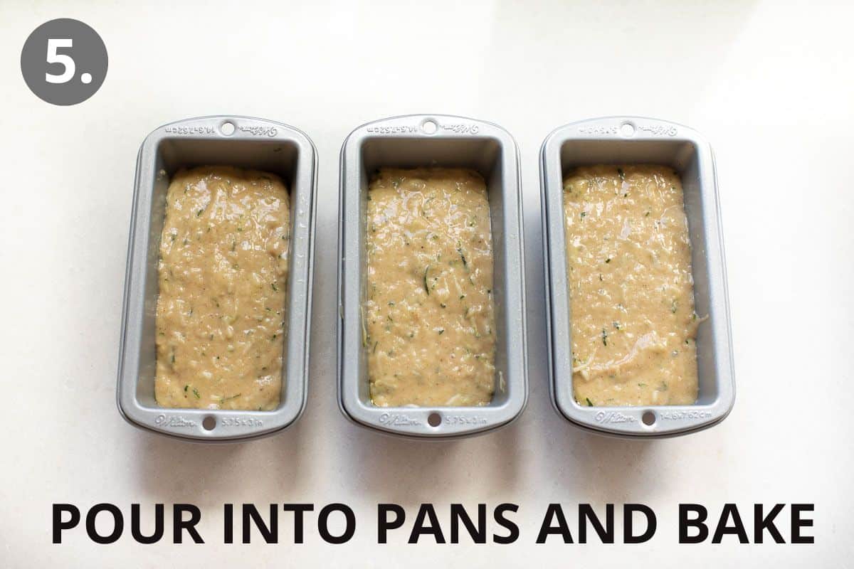 Three loaf pans filled with zucchini bread batter