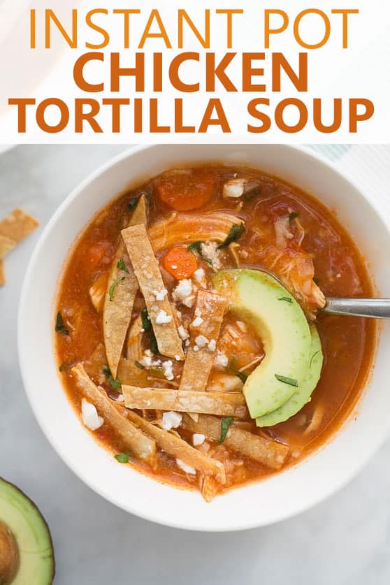 up close image of instant pot chicken tortilla soup in white bowl