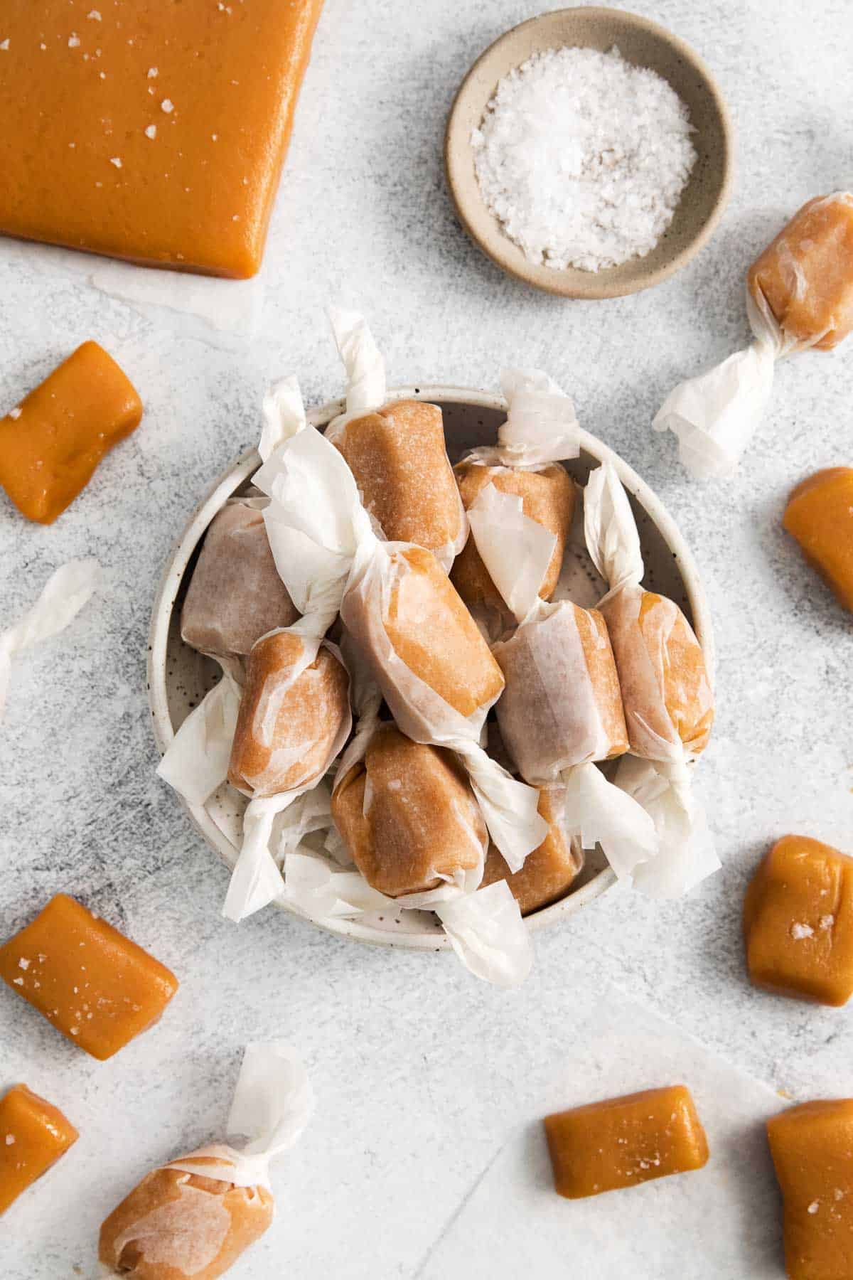 Caramels wrapped in wax paper and placed in a bowl