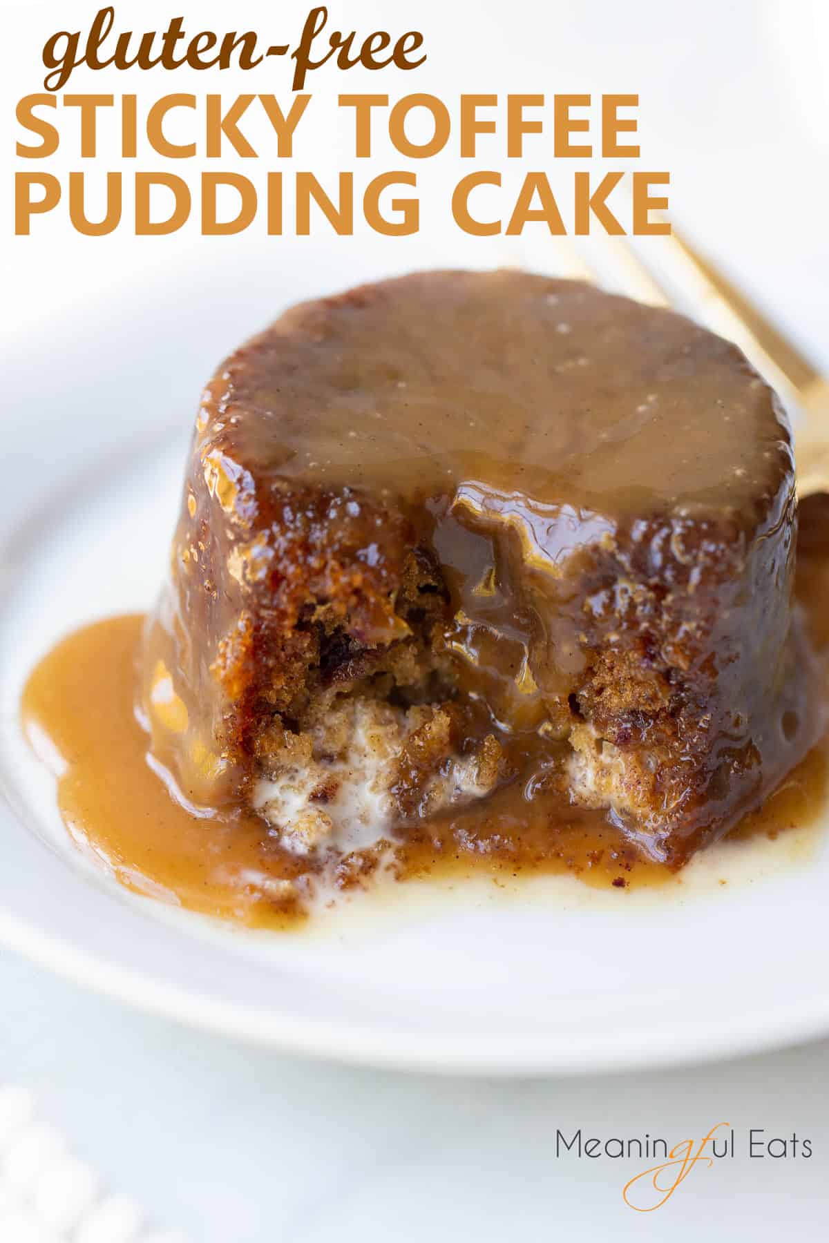 image for pinterest - close up shot of sticky toffee pudding covered in sauce on white plate
