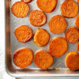 close up shot of roasted sweet potatoes on baking pan