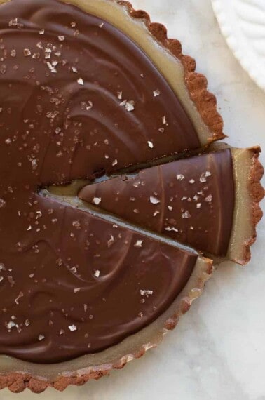 chocolate caramel tart with slice