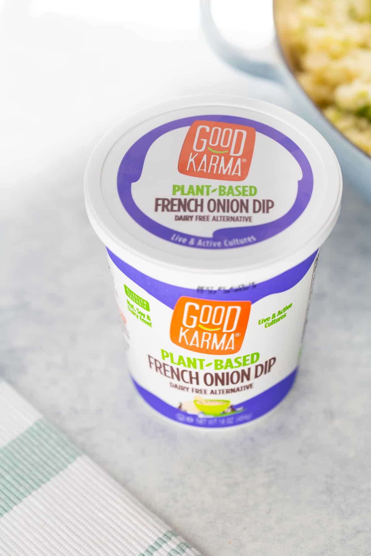 Shot of container of Good Karma Foods French Onion Dip
