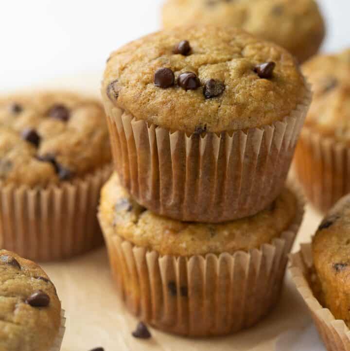 gluten free banana muffins with chocolate chips stacked on top of each other