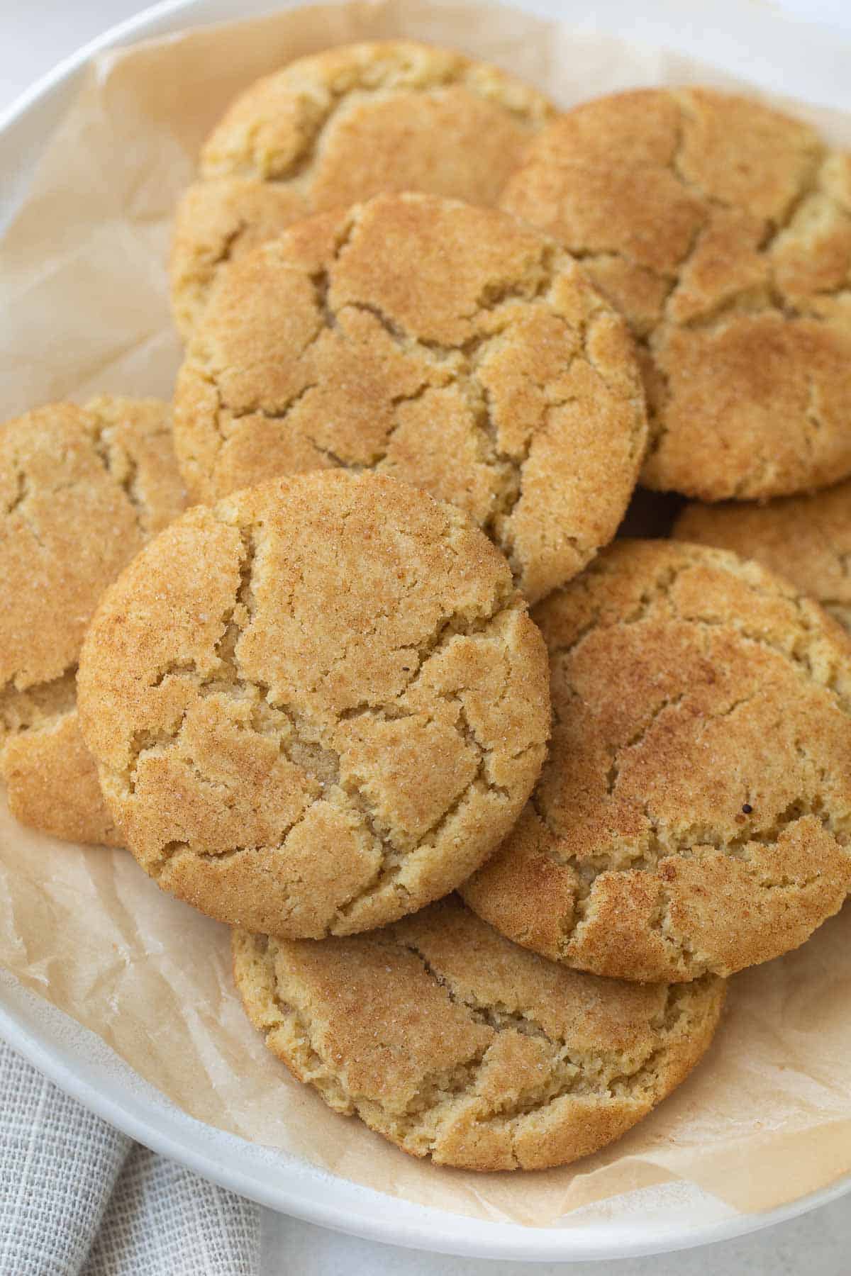 close up shot of gluten-free snickerdoodles on white plate