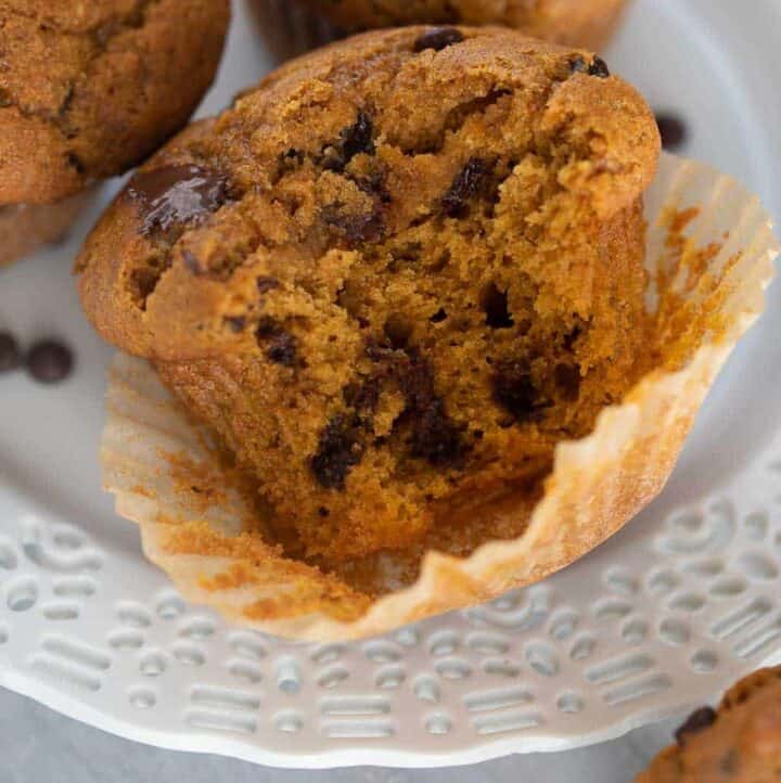 close up shot of gluten-free pumpkin muffin with a bite taken out