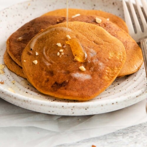 Three pumpkin pancakes on a plate