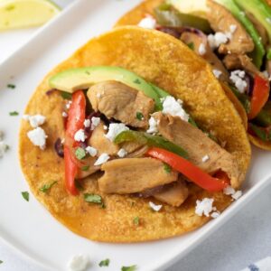 chicken fajitas on white serving dish