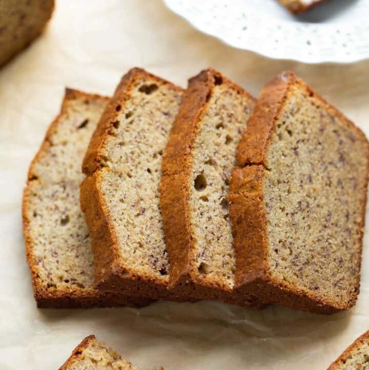 slices of gluten free banana bread on brown parchment paper