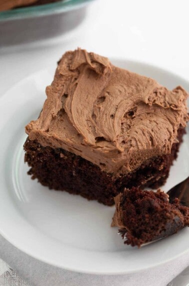 gluten free chocolate cake on white plate with fork