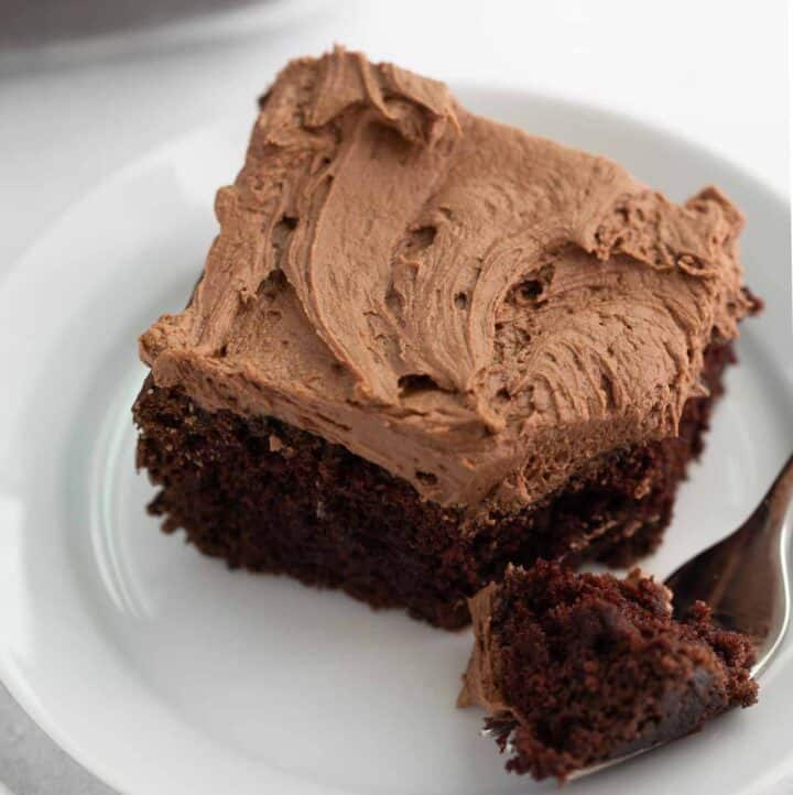 gluten free chocolate cake on white plate with fork